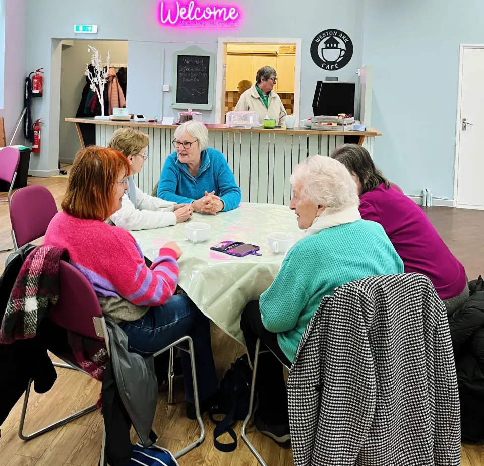 Neighbours enjoying tea and conversation at Ark Café